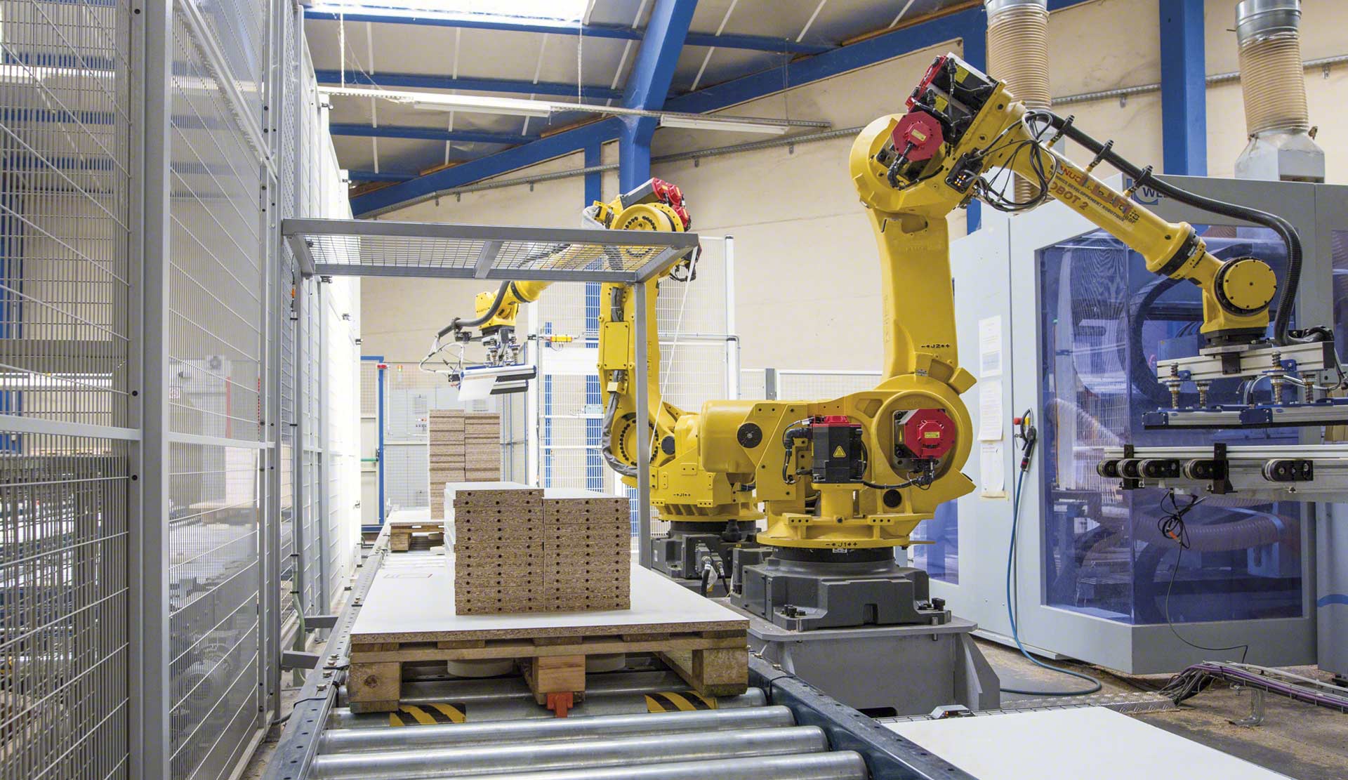O braço robótico industrial ganha espaço no armazém O braço robótico industrial ganha espaço no armazém